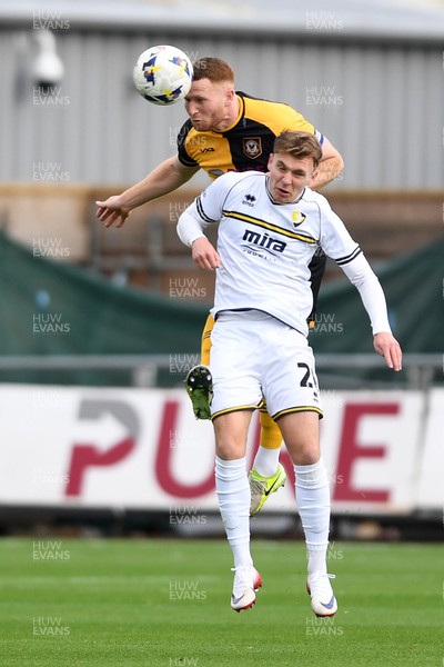 181025 - Newport County v Cheltenham Town - Sky Bet League 2 - Lee Jenkins of Newport County is challenged by Issac Hutchinson of Cheltenham Town