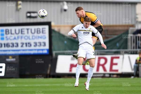 181025 - Newport County v Cheltenham Town - Sky Bet League 2 - Lee Jenkins of Newport County is challenged by Issac Hutchinson of Cheltenham Town