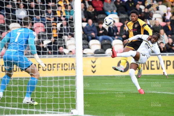 181025 - Newport County v Cheltenham Town - Sky Bet League 2 - Bobby Kamwa of Newport County is challenged by Ethon Archer of Cheltenham Town