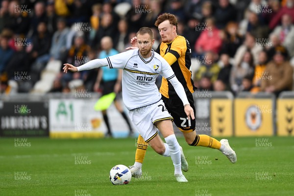 181025 - Newport County v Cheltenham Town - Sky Bet League 2 - Michael Spellman of Newport County is challenged by Ben Stevenson of Cheltenham Town