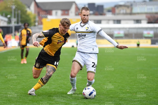 181025 - Newport County v Cheltenham Town - Sky Bet League 2 - Kai Whitmore of Newport County is challenged by Ben Stevenson of Cheltenham Town