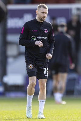 220225 - Newport County v Cheltenham Town - Sky Bet League 2 - Shane McLoughlin of Newport County during the warm up