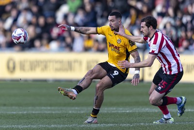 220225 - Newport County v Cheltenham Town - Sky Bet League 2 - Courtney Baker-Richardson of Newport County in action against Sam Stubbs of Cheltenham Town