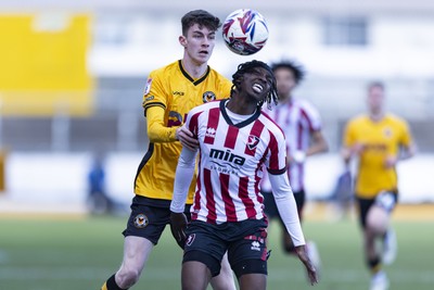 220225 - Newport County v Cheltenham Town - Sky Bet League 2 - Joe Thomas of Newport County in action against Val Adedokun of Cheltenham Town