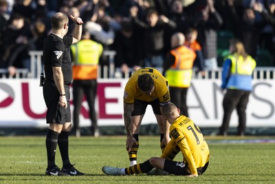 220225 - Newport County v Cheltenham Town - Sky Bet League 2 - Shane McLoughlin of Newport County down injured after Cheltenham Town score their second goal