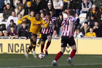 220225 - Newport County v Cheltenham Town - Sky Bet League 2 - Bobby Kamwa of Newport County in action