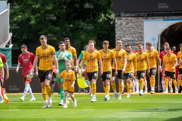 290723 - Newport County v Cheltenham Town - Preseason Friendly - Newport County players walk on to the pitch 