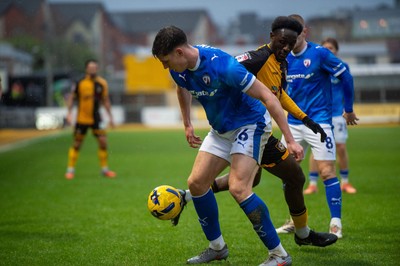 240126 - Newport County v Chesterfield - Sky Bet League 2 - Sil Swinkles of Chesterfield clears under pressure from James Crole of Newport County