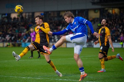 240126 - Newport County v Chesterfield - Sky Bet League 2 - James Berry of Chesterfield clears under pressure from Michael Spellman of Newport County