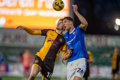 240126 - Newport County v Chesterfield - Sky Bet League 2 - James Crole of Newport County and Sil Swinkels of Chesterfield compete for the ball