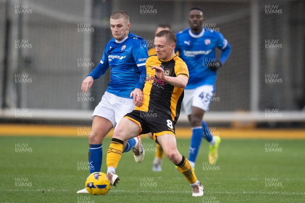 240126 - Newport County v Chesterfield - Sky Bet League 2 - Matthew Smith of Newport County holds off Ryan Stirk of Chesterfield