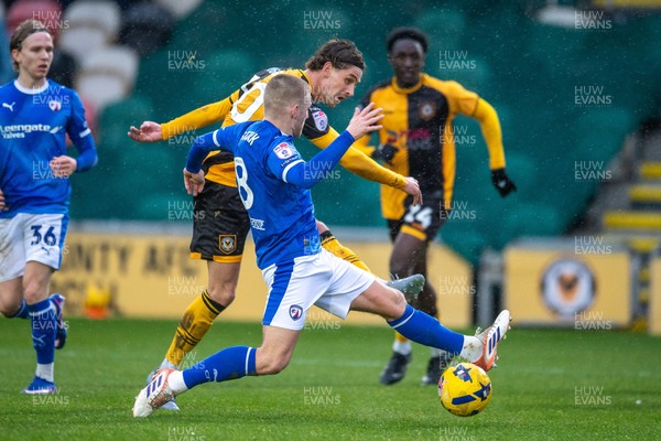 240126 - Newport County v Chesterfield - Sky Bet League 2 - Harrison Biggins of Newport County beats Ryan Stirk of Chesterfield