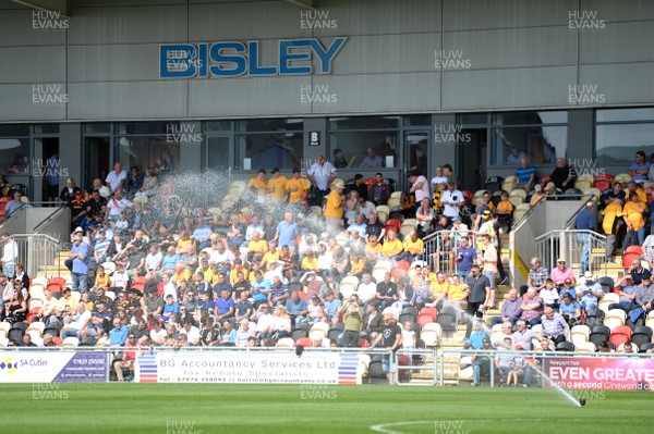 260817 - Newport County v Chesterfield - SkyBet League 2 - Fans look on as the pitch is watered before kick off