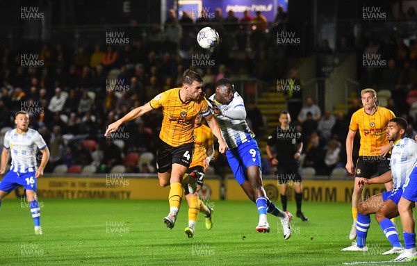 031023 - Newport County v Colchester United - EFL SkyBet League 2 - Ryan Delaney of Newport County and Samson Tovide of Colchester United