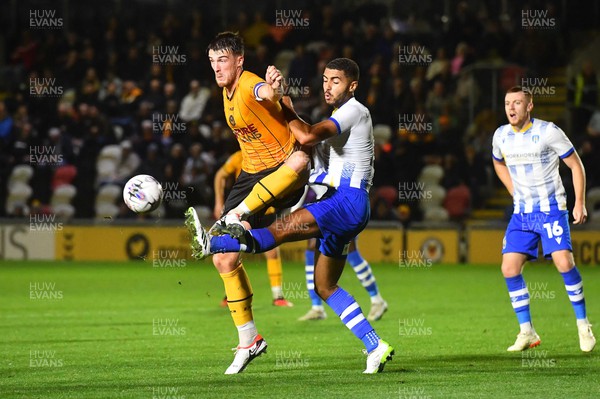 031023 - Newport County v Colchester United - EFL SkyBet League 2 - Ryan Delaney of Newport County and Will Greenidge of Colchester United