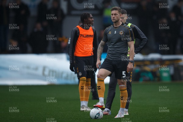 051122 - Newport County v Colchester United - FA Cup First Round - James Clarke of Newport County warms up ahead of the match