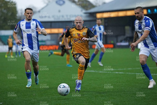 051122 - Newport County v Colchester United - FA Cup First Round - James Waite of Newport County chases the ball