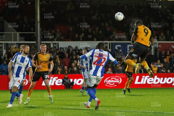 051122 - Newport County v Colchester United - FA Cup First Round - Omar Bogle of Newport County heads the ball towards goal