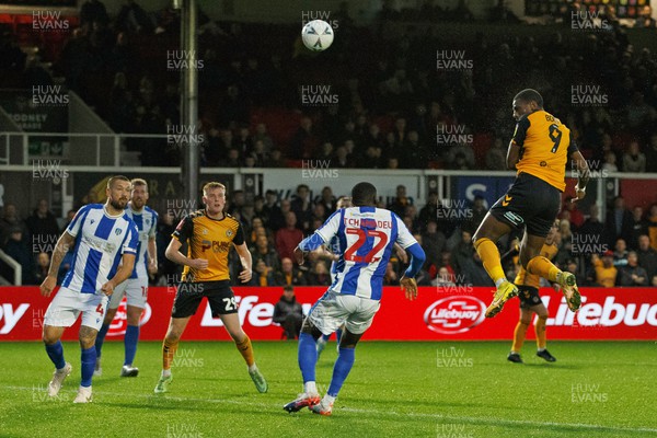 051122 - Newport County v Colchester United - FA Cup First Round - Omar Bogle of Newport County heads the ball towards goal