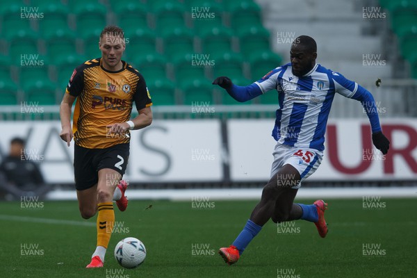 051122 - Newport County v Colchester United - FA Cup First Round - Cameron Norman of Newport County takes on Frank Nouble of Colchester United
