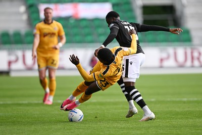 101026 - Newport County v Colchester United - Sky Bet League 2 - Michael Adu-Poku of Newport County is challenged by Beryly Lubala of Colchester