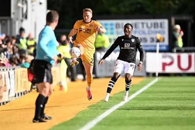 101026 - Newport County v Colchester United - Sky Bet League 2 - Cameron Norman of Newport County fails to keep the ball in play