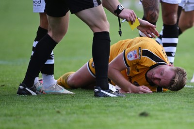 101026 - Newport County v Colchester United - Sky Bet League 2 - Cameron Norman of Newport County goes down after a challenge by Jay Williams of Colchester