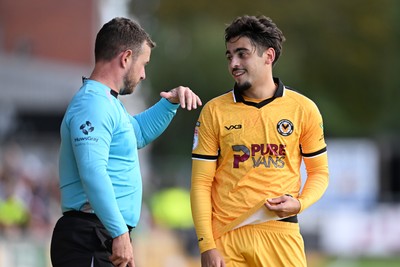 101026 - Newport County v Colchester United - Sky Bet League 2 - Matt Dibley-Dias of Newport County speaks with the linesman
