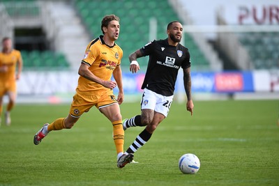 101026 - Newport County v Colchester United - Sky Bet League 2 - Harrison Biggins of Newport County is challenged by Sean Raggett of Colchester