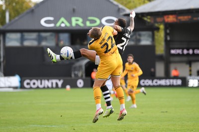 101026 - Newport County v Colchester United - Sky Bet League 2 - Cameron Norman of Newport County is challenged by Jay Williams of Colchester