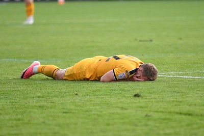 101026 - Newport County v Colchester United - Sky Bet League 2 - Cameron Norman of Newport County goes down after a challenge by Jay Williams of Colchester