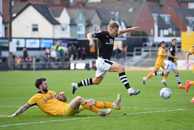 101026 - Newport County v Colchester United - Sky Bet League 2 - Kyle Cameron of Newport County is challenged by Jack Tucker of Colchester