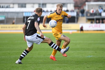 101026 - Newport County v Colchester United - Sky Bet League 2 - Matty Jacob of Newport County is challenged by Harry Anderson of Colchester