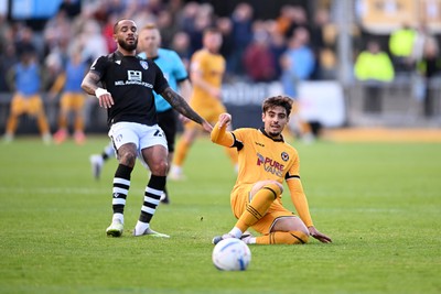 101026 - Newport County v Colchester United - Sky Bet League 2 - Matt Dibley-Dias of Newport County is challenged by Jay Williams of Colchester