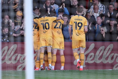 101026 - Newport County v Colchester United - Sky Bet League 2 - Tanatswa Nyakuhwa of Newport County celebrates scoring a goal with team mates