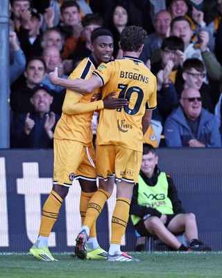 101026 - Newport County v Colchester United - Sky Bet League 2 - Tanatswa Nyakuhwa of Newport County celebrates scoring a goal with team mates