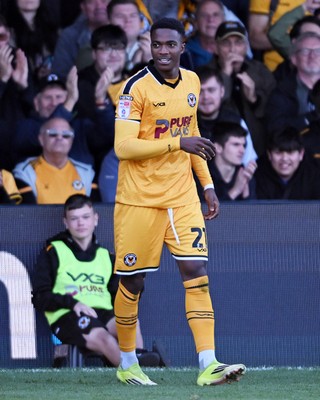 101026 - Newport County v Colchester United - Sky Bet League 2 - Tanatswa Nyakuhwa of Newport County celebrates scoring a goal with team mates
