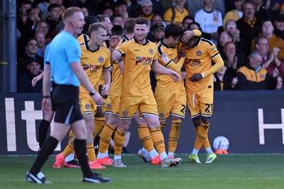101026 - Newport County v Colchester United - Sky Bet League 2 - Tanatswa Nyakuhwa of Newport County celebrates scoring a goal with team mates