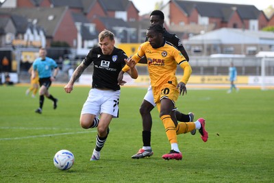 101026 - Newport County v Colchester United - Sky Bet League 2 - Yahya Bamba of Newport County is challenged by Harry Anderson of Colchester