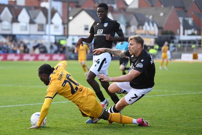 101026 - Newport County v Colchester United - Sky Bet League 2 - Yahya Bamba of Newport County is challenged by Harry Anderson of Colchester