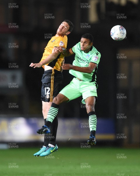 171017 - Newport County v Colchester United - SkyBet League 2 - Ben Tozer of Newport County and Brandon Comley of Colchester United compete in the air