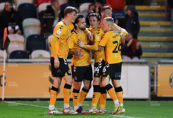 220422 - Newport County v Colchester United, Sky Bet League 2 - Dom Telford of Newport County celebrates with team mates after he scores the opening goal