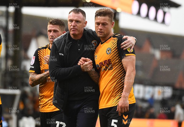 221022 - Newport County v Colchester United - EFL SkyBet League 2 - Newport County Manager Graham Coughlan and James Clarke of Newport County at the end of the game
