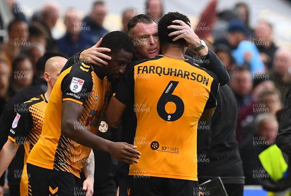 221022 - Newport County v Colchester United - EFL SkyBet League 2 - Newport County Manager Graham Coughlan with Omar Bogle and Priestley Farquharson of Newport County at the end of the game