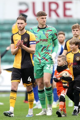 070326 - Newport County v Colchester United - Sky Bet League 2 - Matthew Baker of Newport County leads his team out