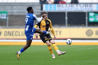 070326 - Newport County v Colchester United - Sky Bet League 2 - Ryan Delaney of Newport County clears under pressure from Samson Tovide of Colchester United 