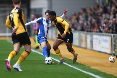 070326 - Newport County v Colchester United - Sky Bet League 2 - Bobby Kamwa of Newport County takes on Finley Barbrook of Colchester United 