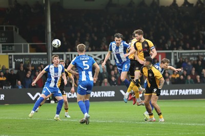 070326 - Newport County v Colchester United - Sky Bet League 2 - Matthew Baker of Newport County heads for goal 