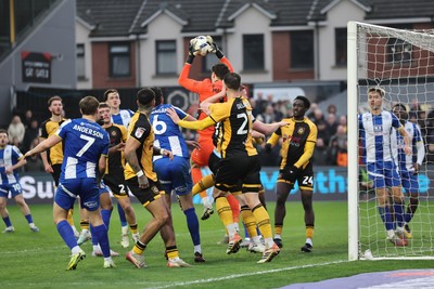 070326 - Newport County v Colchester United - Sky Bet League 2 - Matt Macey of Colchester United claims the ball 