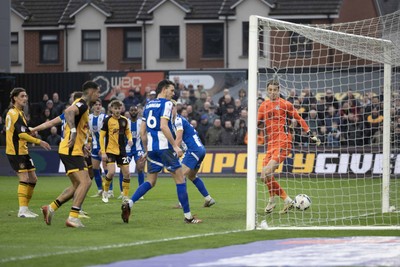 070326 - Newport County v Colchester United - Sky Bet League 2 - Players watch as the ball hits the Colchester post